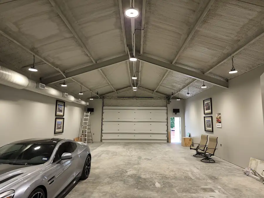Finished garage shop with pendant high-bay fixtures down the ridge