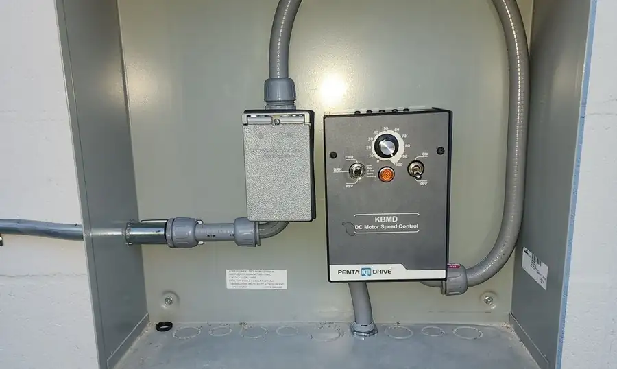 DC motor speed control wired into an enclosure with flexible conduit
